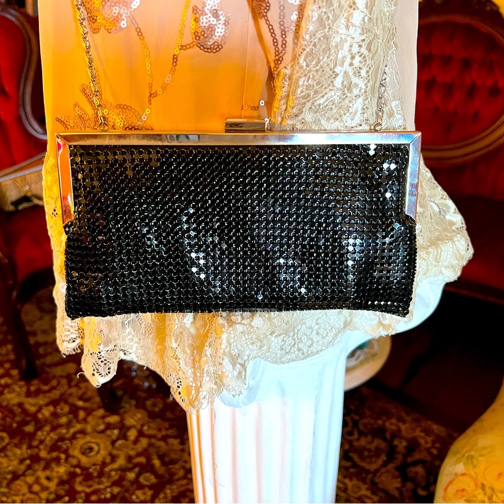 Cute black clutch flexible metal look. Perfect accessory for evening wear.